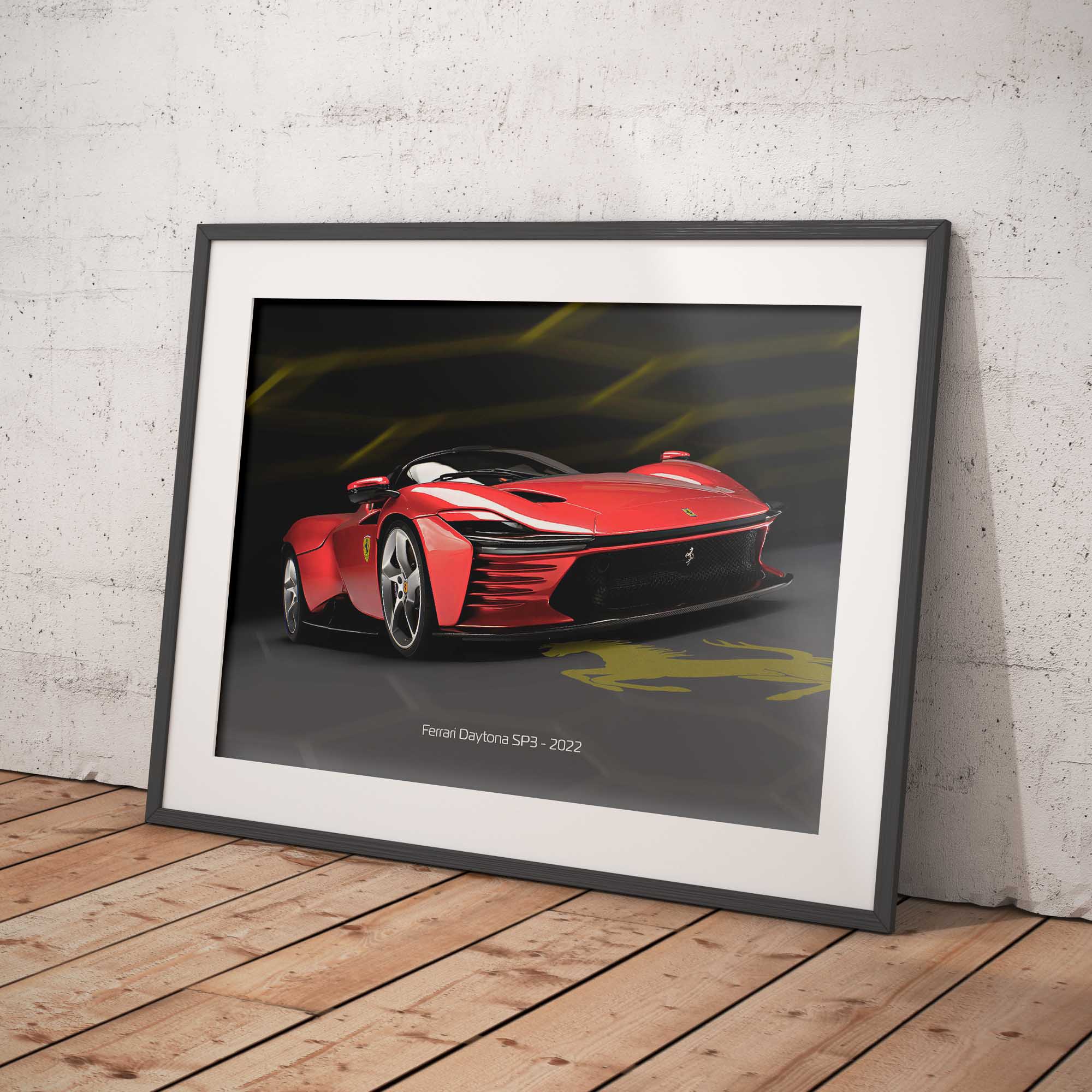 Framed artwork of a red Ferrari sports car on a wooden floor with a white brick wall background
