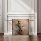 Framed artwork of an elephant on a wall with decorative moulding.