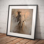 Framed artwork of an elephant on a textured wall.