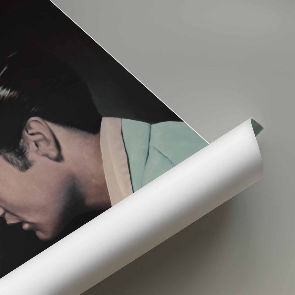 Rolled up poster of Elvis Presley wearing a suit.