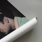 Rolled up poster of Elvis Presley wearing a suit.