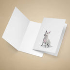 Greeting card with an English Bull Terrier on a beige background