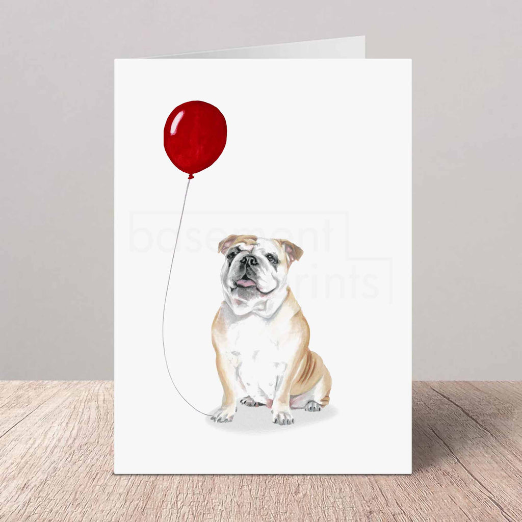 Greeting card with a bulldog holding a red balloon on a white background
