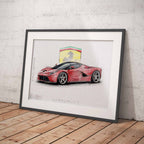 Framed artwork of a red Ferrari LaFerrari sports car with a Ferrari logo on a white brick wall background.