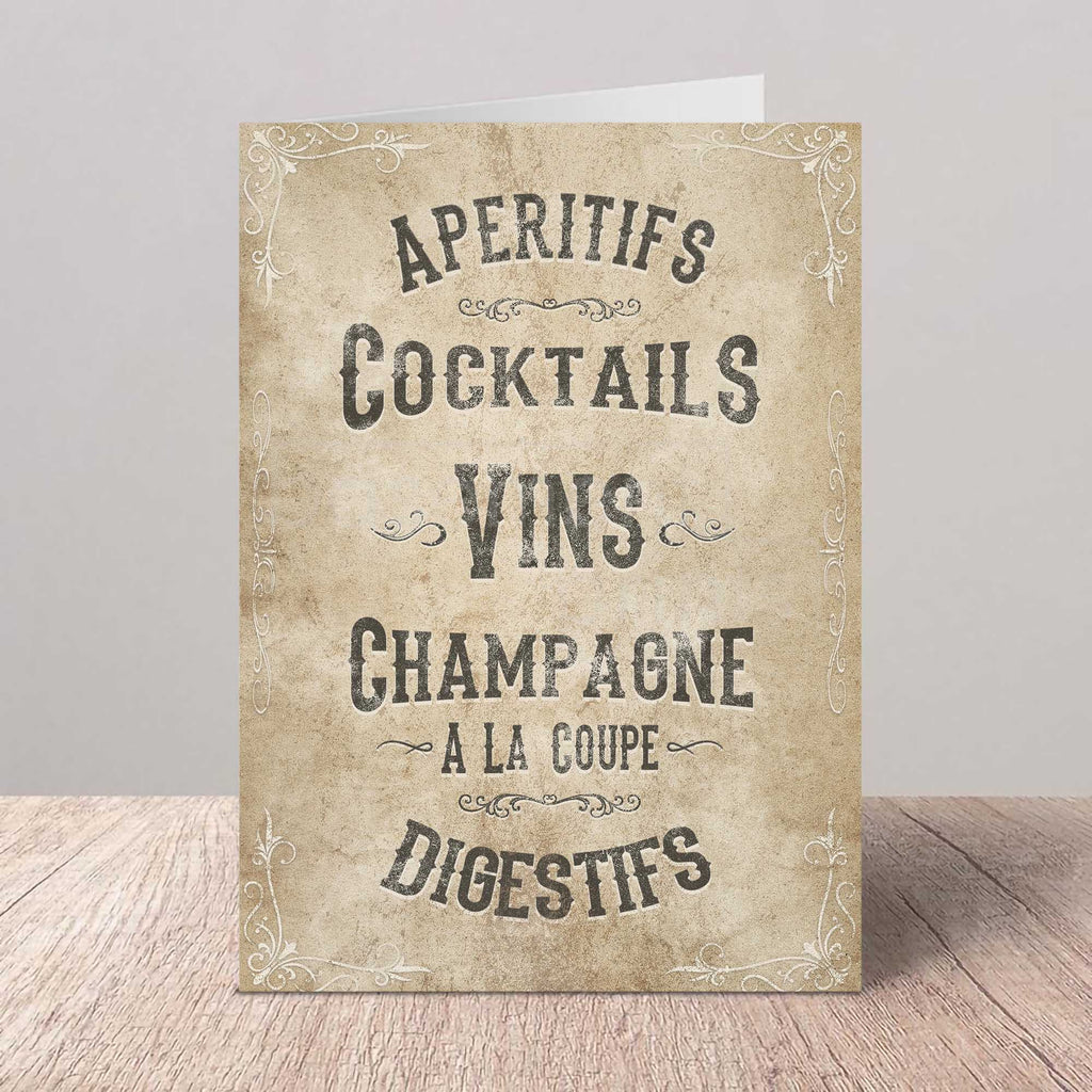 Vintage-style card with French text on a wooden surface