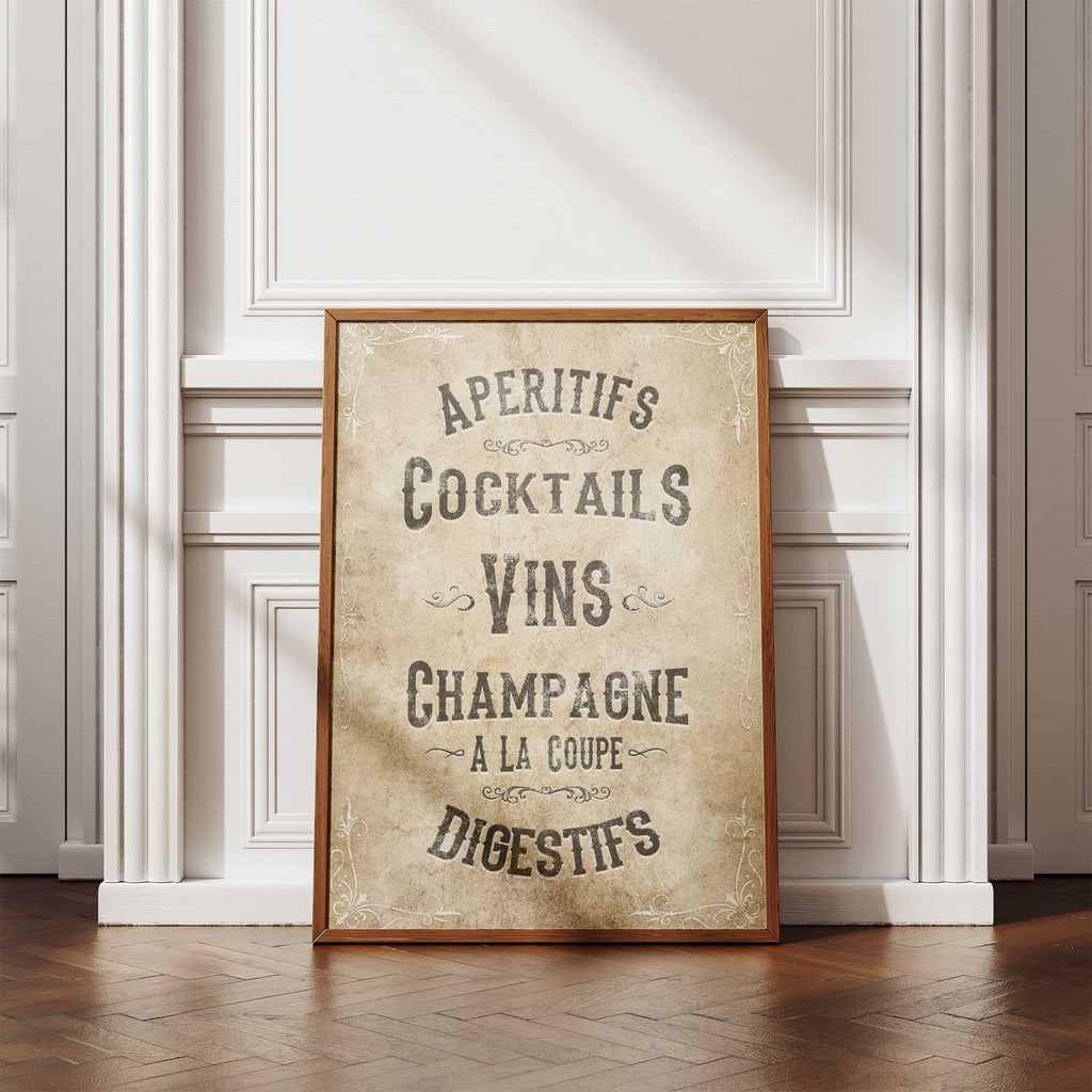 Framed poster with French drinks list on a wall in a room with wooden flooring.