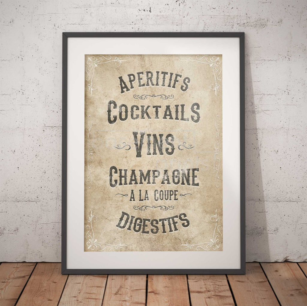 Framed vintage-style poster with a  French drinks menu on a textured wall.