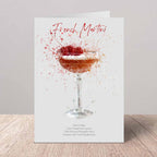 Card with a French Martini illustration and recipe on a wooden surface.