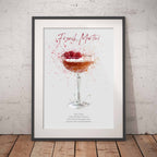 Framed artwork of a French Martini cocktail against a white brick wall.