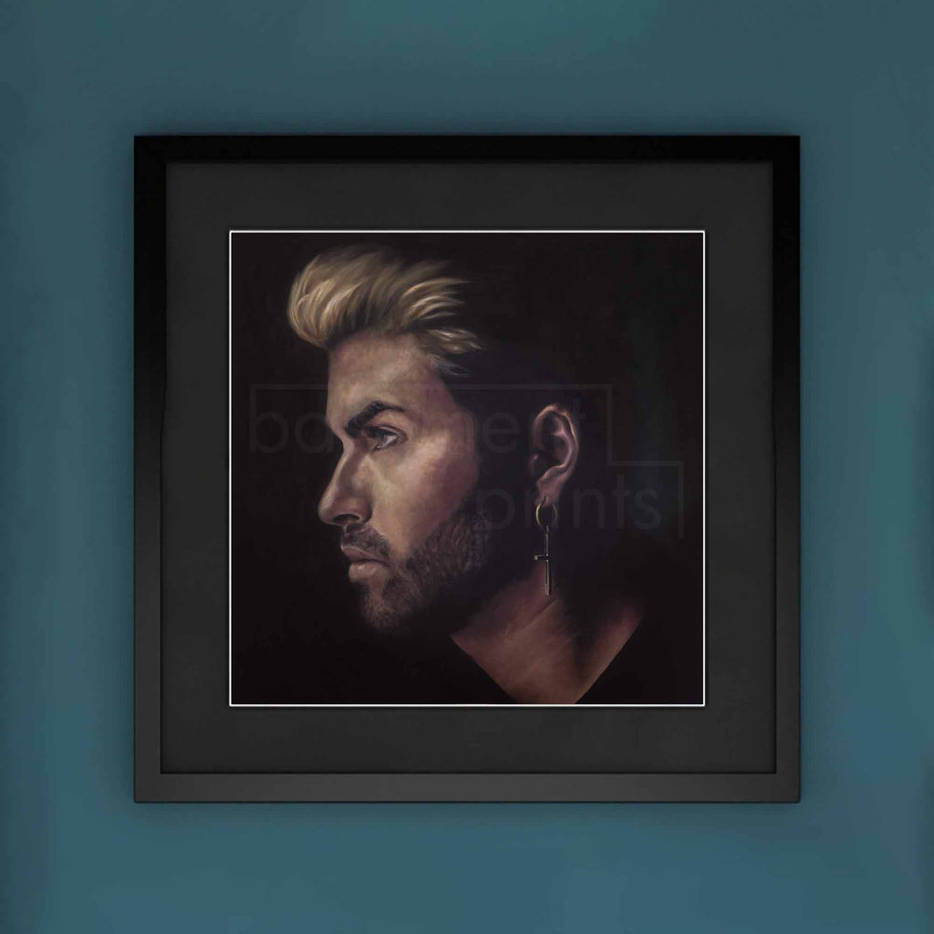 Framed portrait of a George Michael on a blue wall.