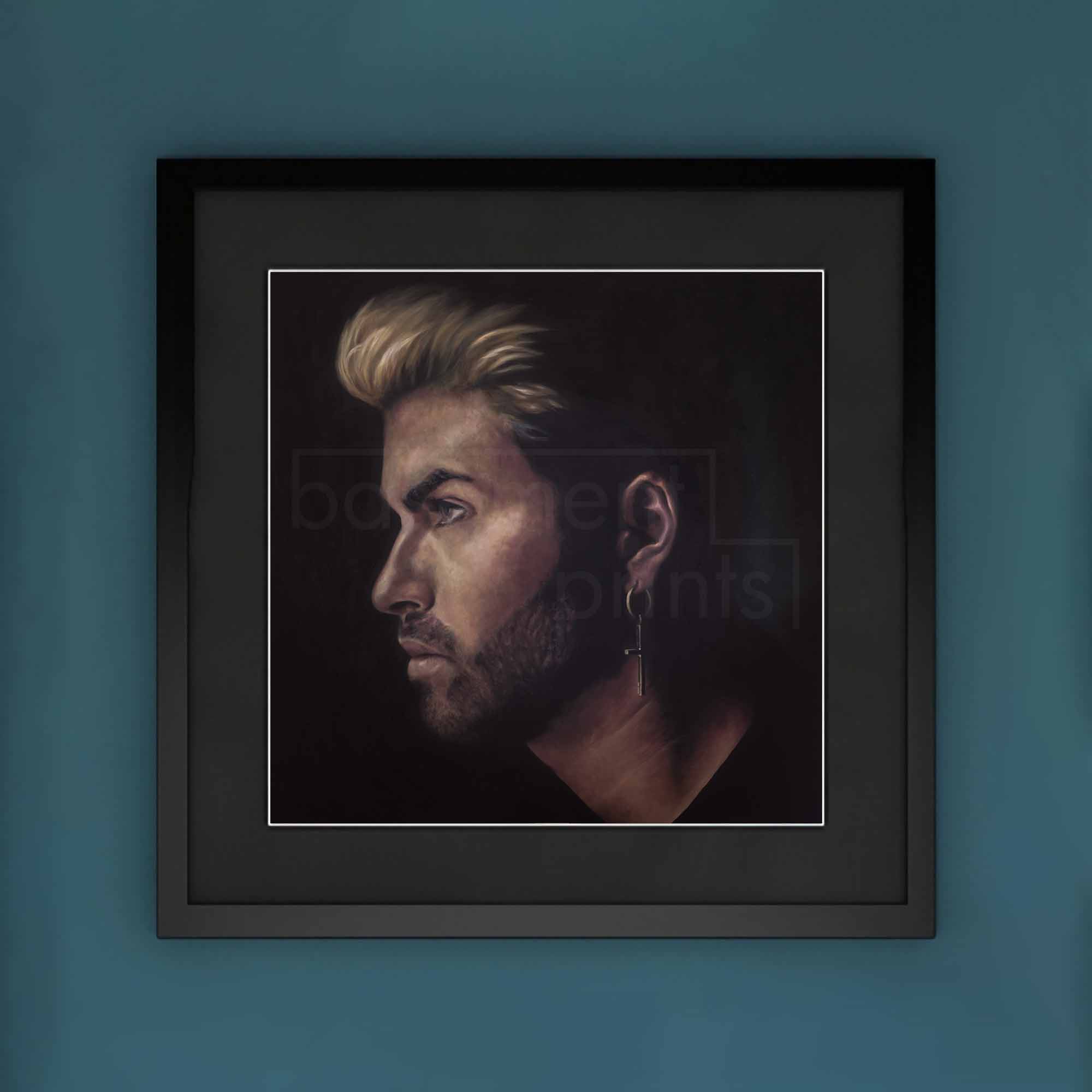 Framed portrait of a George Michael on a blue wall.
