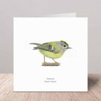 Greeting card with a goldcrest illustration on a white background