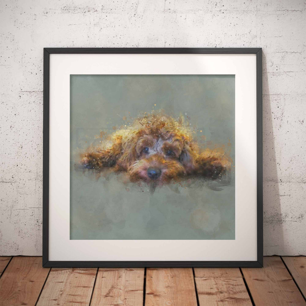Framed artwork of a golden cockapoo dog on a gray background, leaning against a textured wall.