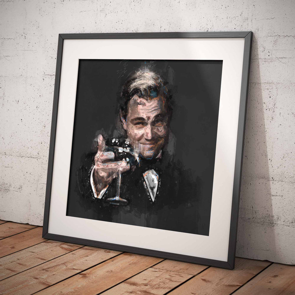 Framed stylised artwork of The Great Gatsby celebratory cheers on a white brick wall.