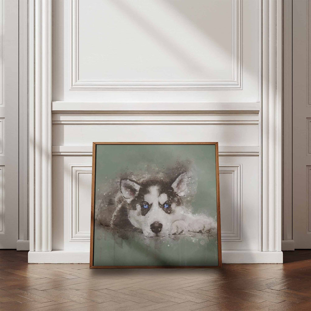 Framed artwork of a husky dog with blue eyes on a wall in a room with wooden flooring and white walls.
