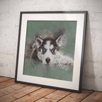 Framed artwork of a Husky dog, leaning against a textured white wall.