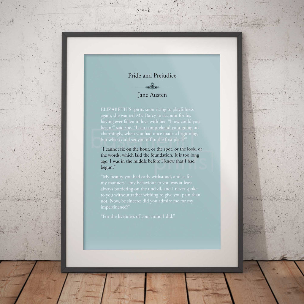 Framed text print of a quote from 'Pride and Prejudice' by Jane Austen against a brick wall.