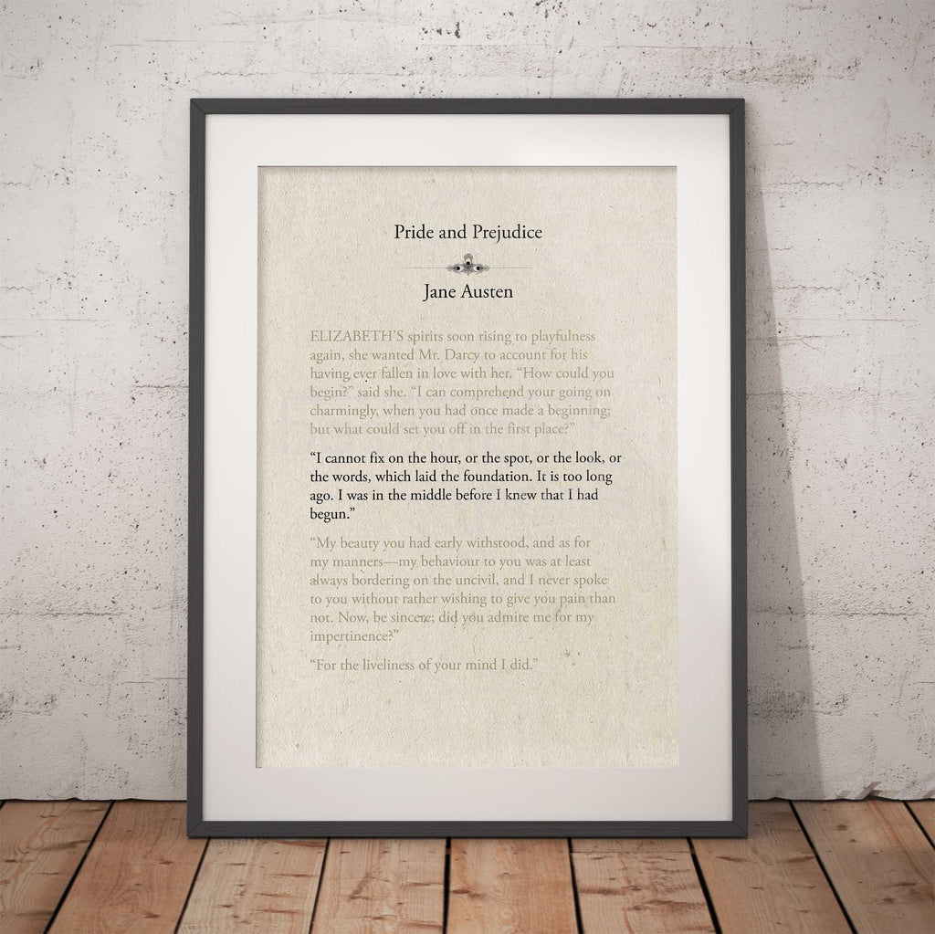 Framed text print of a quote from 'Pride and Prejudice' by Jane Austen against a brick wall.