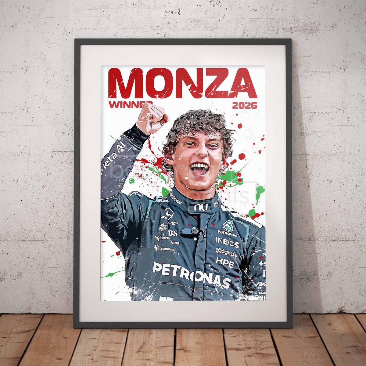 A framed art print leaning against a light gray concrete wall on a wooden floor. The print features a stylized portrait of Mercedes driver kimi Antonelli celebrating his Monza 2026 win, with 'MONZA WINNER 2026' written in bold red text at the top.