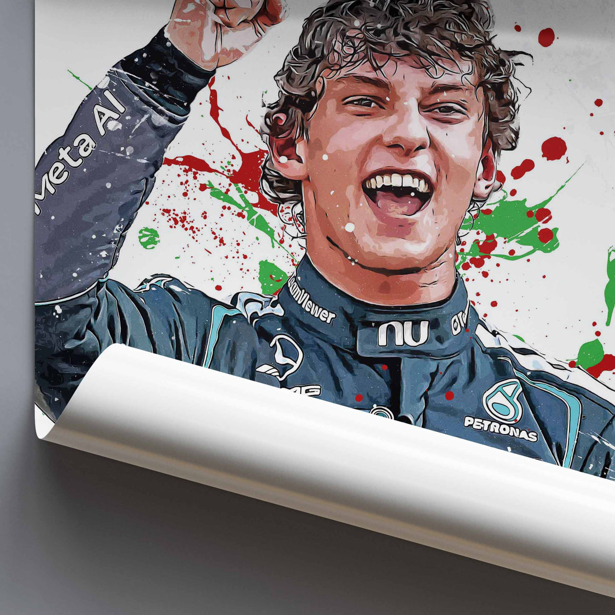 A close-up of a rolled poster or print showing a stylized portrait of Kimi Antonelli in his race suit with sponsor logos, against a white background with red and green paint splatters. The poster is shown against a gray surface.