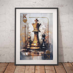 Framed wall art leaning against a light textured wall on a wooden floor, showing an abstract painting of a king chess pieces inspired by a playing card design with a gold queen and black/white pawns.
