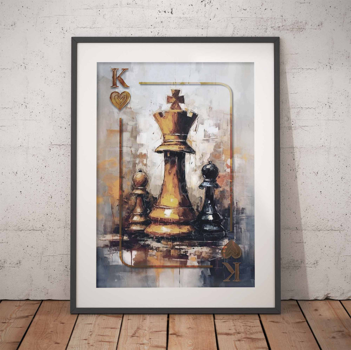 Framed wall art leaning against a light textured wall on a wooden floor, showing an abstract painting of a king chess pieces inspired by a playing card design with a gold queen and black/white pawns.
