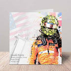 Greeting card with Lando Norris in an orange racing suit and helmet, featuring a colourful design with flags.