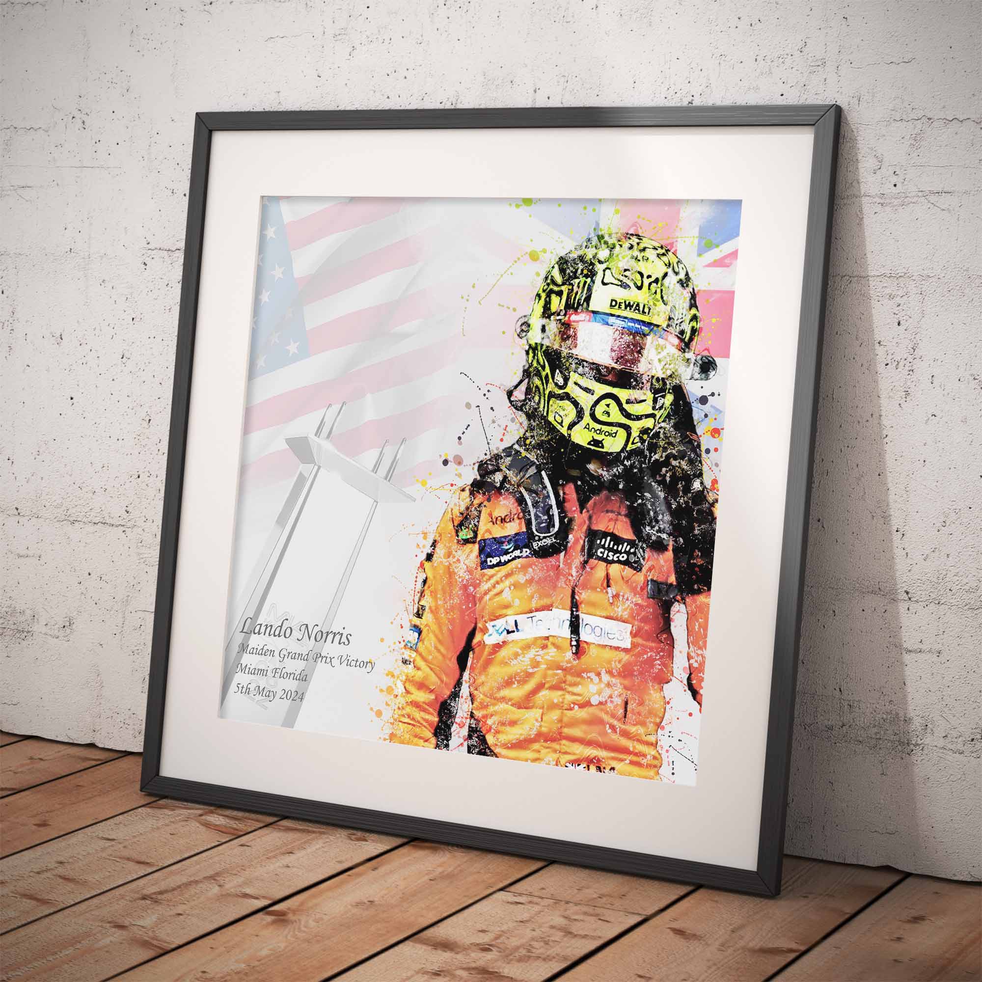 Framed artwork of  Lando Norris after his first Formula 1 Win against a colorful background on a white wall.
