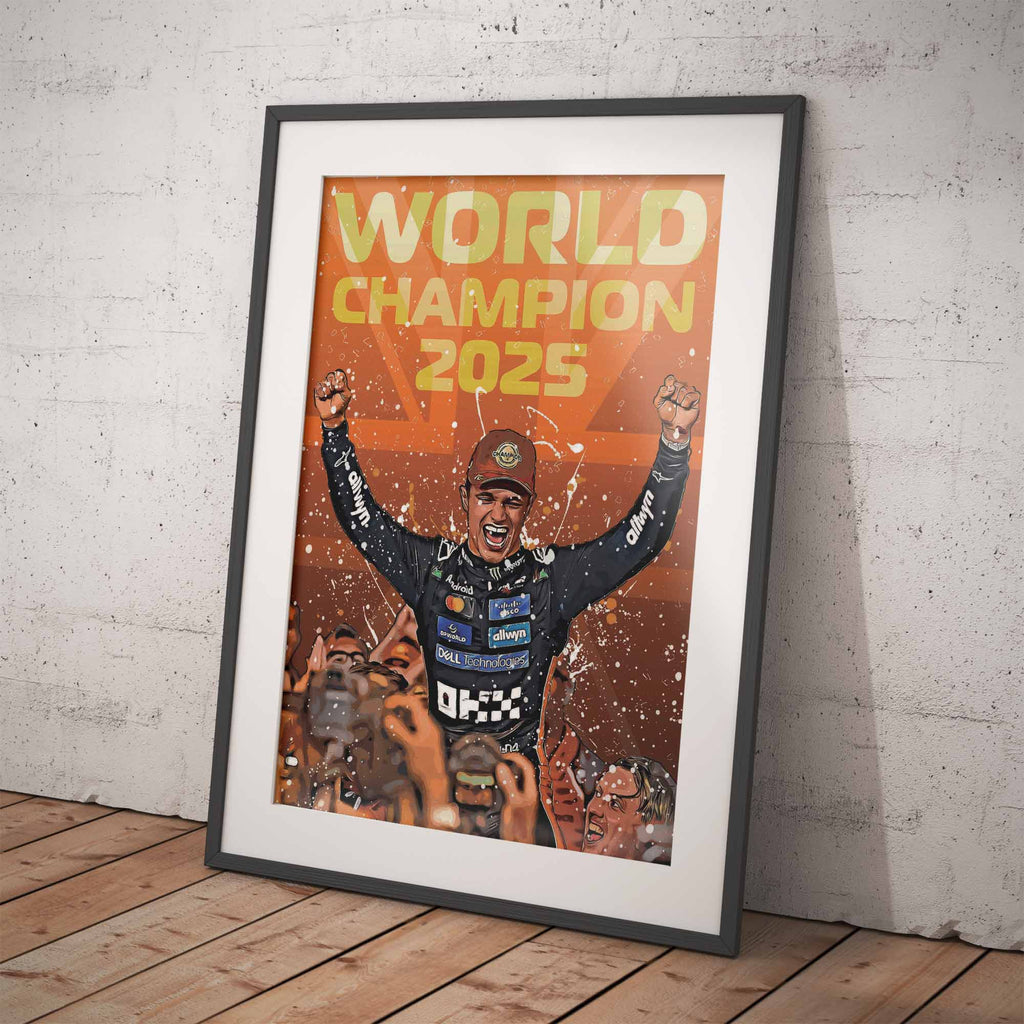 Framed artwork of Lando Norris celebrating the F1 World Championship 2025 leaning against a white brick wall.