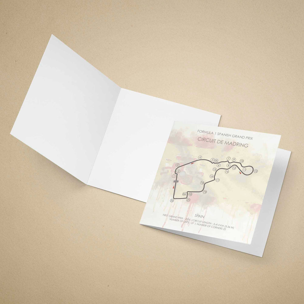 A greeting card set on a warm beige background, with the front insert showing a printed circuit map and text for the Formula 1 Spanish Grand Prix at Circuit de Madrig.
