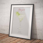 Framed print of a margarita with a lime in a glass against a light gray background.