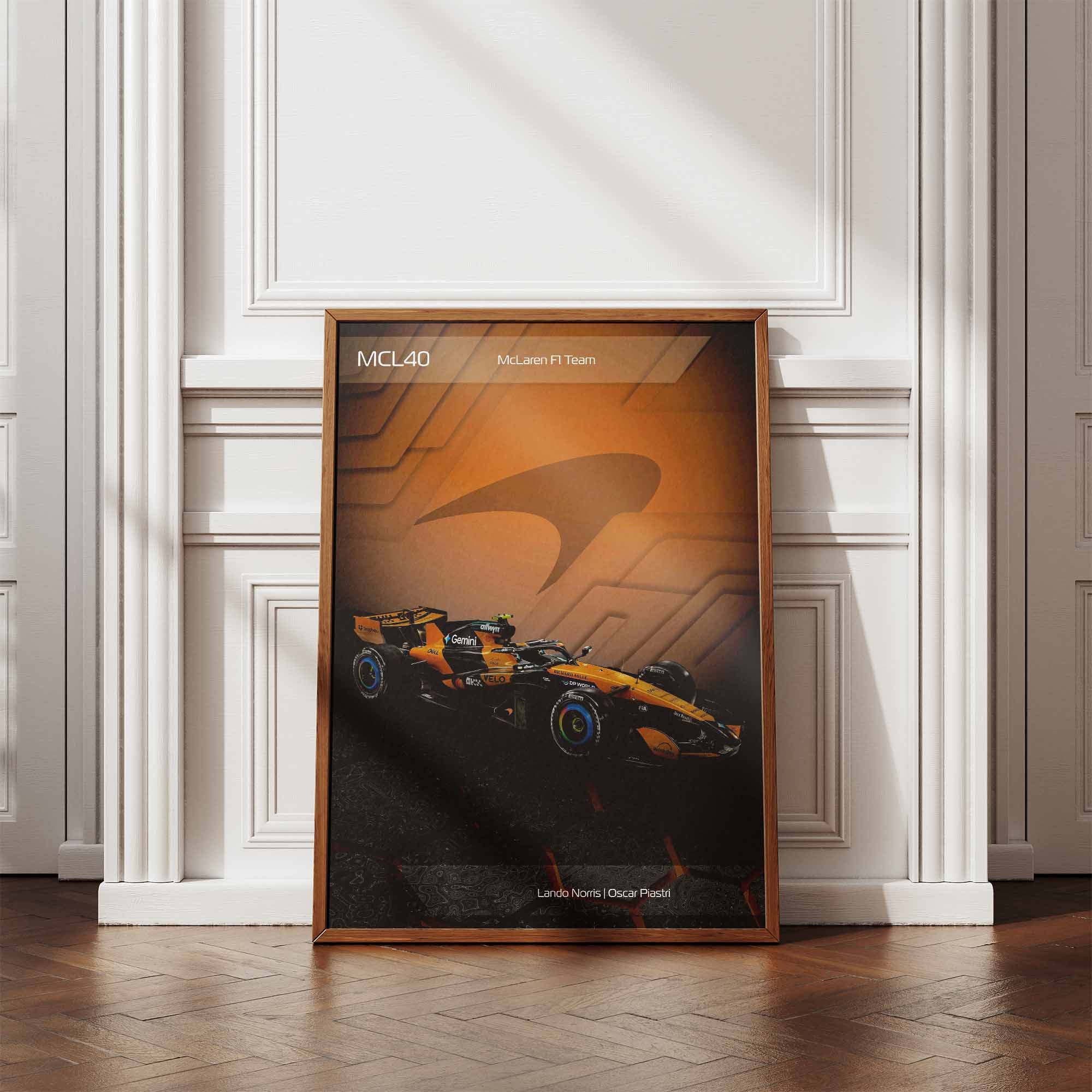 Framed poster of the McLaren MCL40 2026 Formula 1 car leaning against a wall