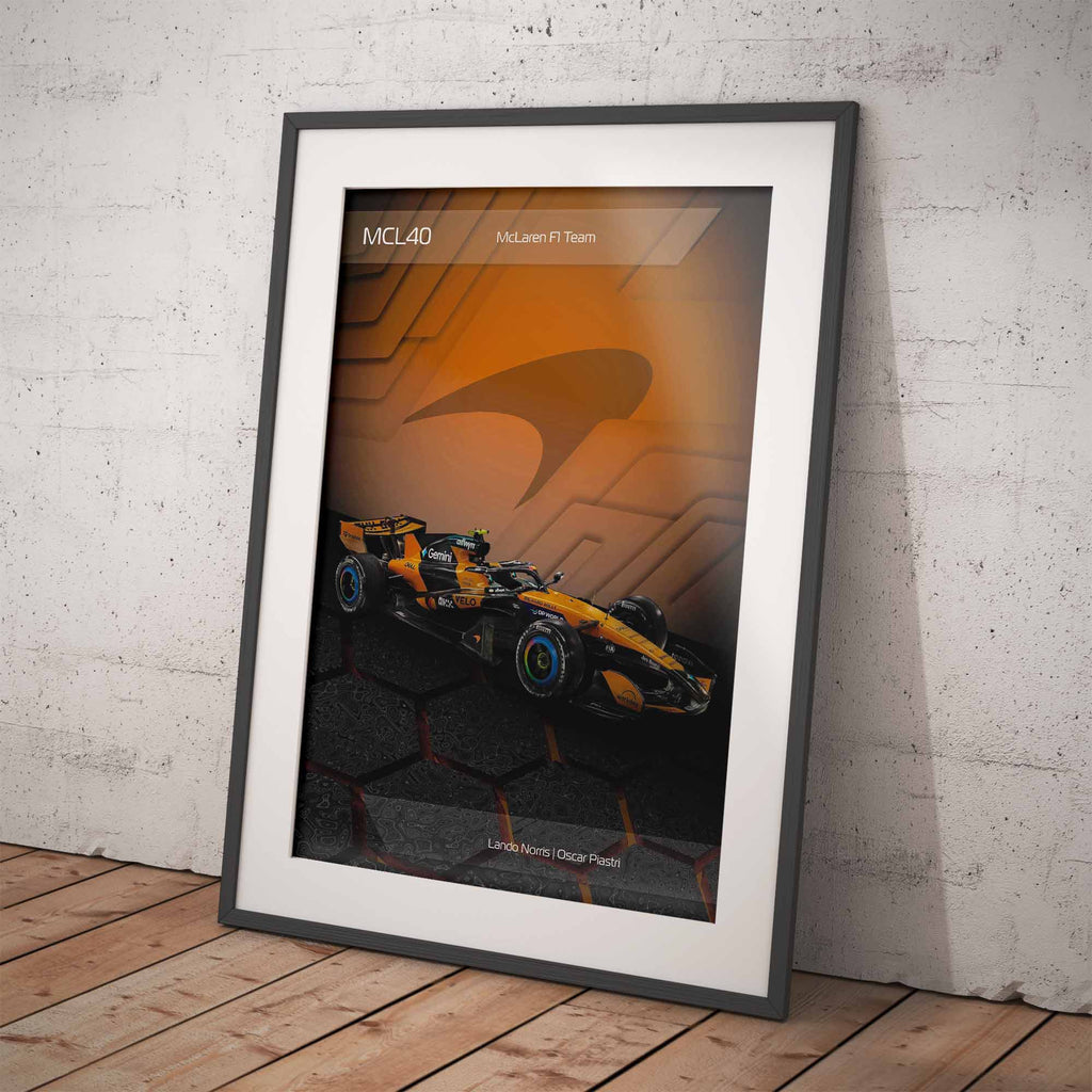 Framed poster of the McLaren MCL40 2026 Formula 1 car on a white brick wall background