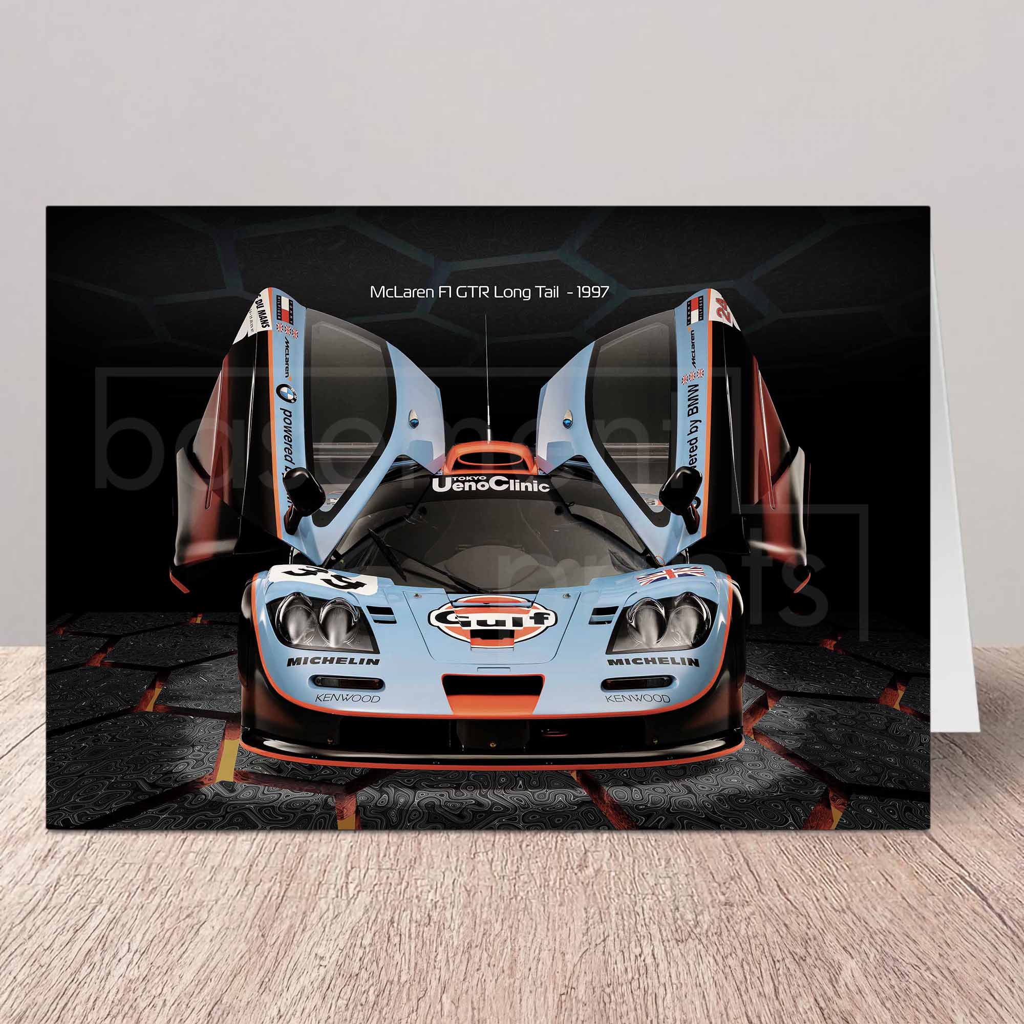 Greeting card of a McLaren F1 GTR Gulf racing car on a white background.