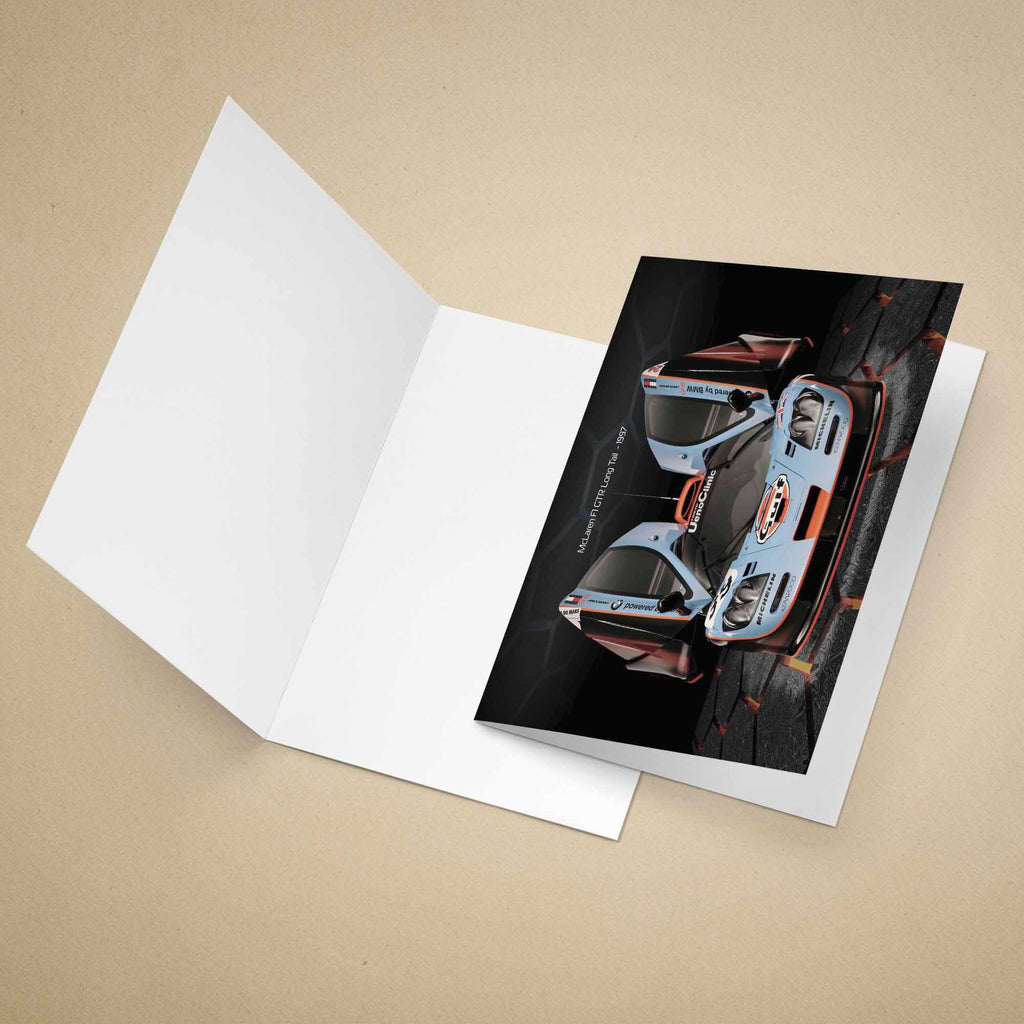 Greeting card of a McLaren F1 GTR Gulf racing car on a beige background.