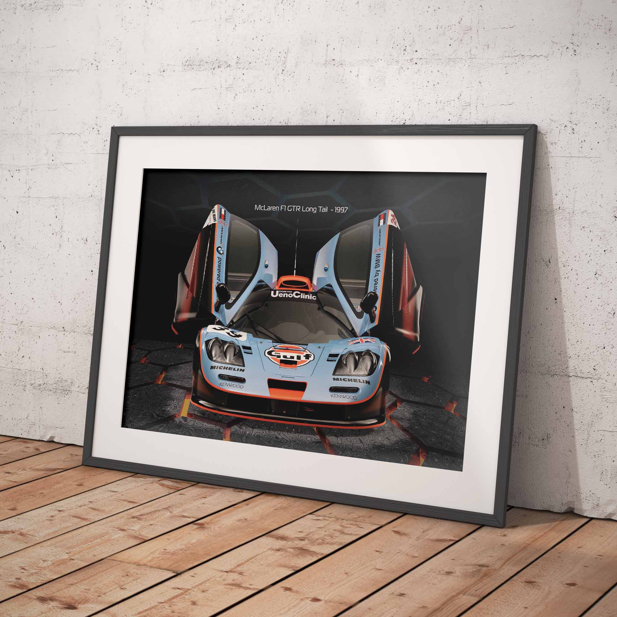 Framed print of a McLaren F1 GTR Gulf racing car on a white wall.