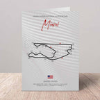 Poster of Miami International Autodrome with track layout on a textured surface