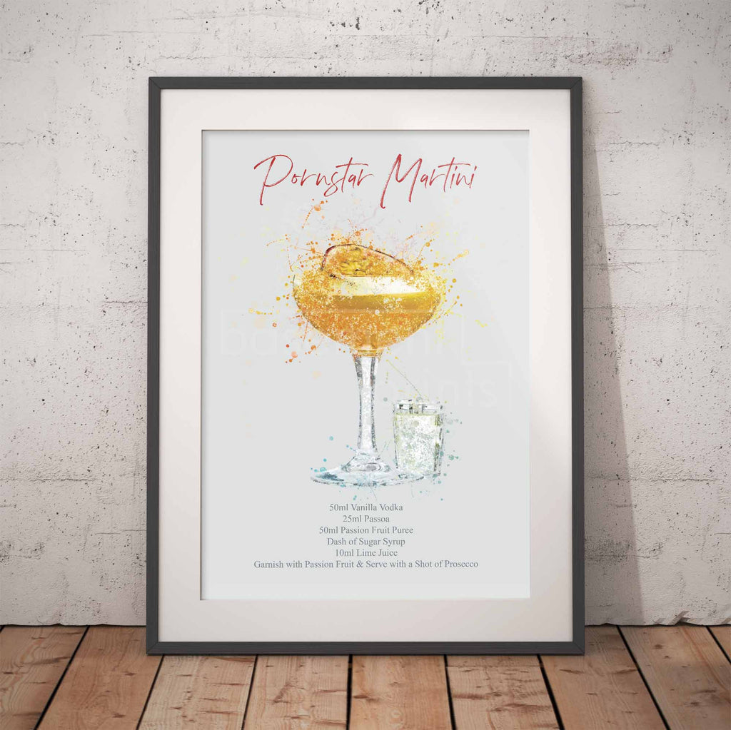 Framed Pornstar Martini cocktail recipe print for a 'Pernod Martini' against a brick wall.