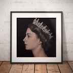 Framed portrait of Queen Elizabeth II wearing a crown against a black background
