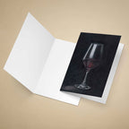 Greeting Card with a dark oil painted red wine glass on a beige background.