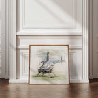 Framed artwork of a helicopter on a wall with decorative molding.