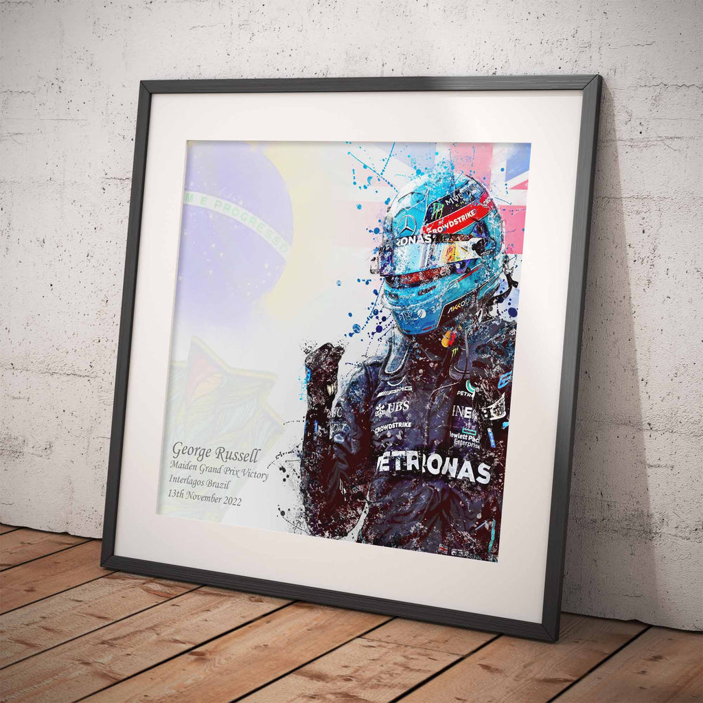 Framed artwork of  George Russell after his first Formula 1 Win against a colorful background on a white wall.
