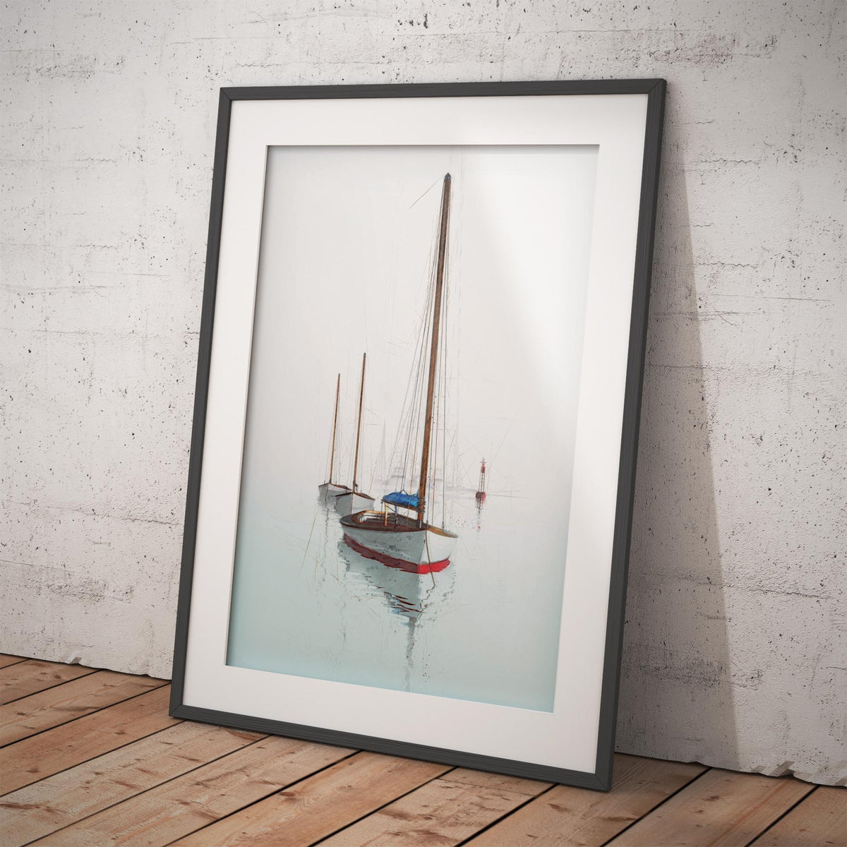 A framed art print of a classic sailboat on calm water, leaning against a white brick wall on a wooden floor.
