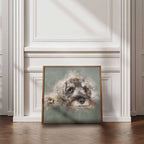 Framed artwork of a Schnauzer dog on a wall in a room with wooden flooring and white walls.
