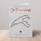 Greetings card of Spa Francorchamps circuit layout with Belgium flag on a wooden surface and light gray background