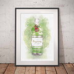 Framed artwork of a Tanqueray gin bottle on a white background with a green splash.