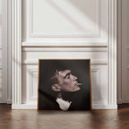 Framed portrait of Thomas Shelby smoking a cigarette on a wall with decorative molding.