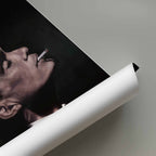 Rolled poster with Thomas Shelby smoking against a gray background.