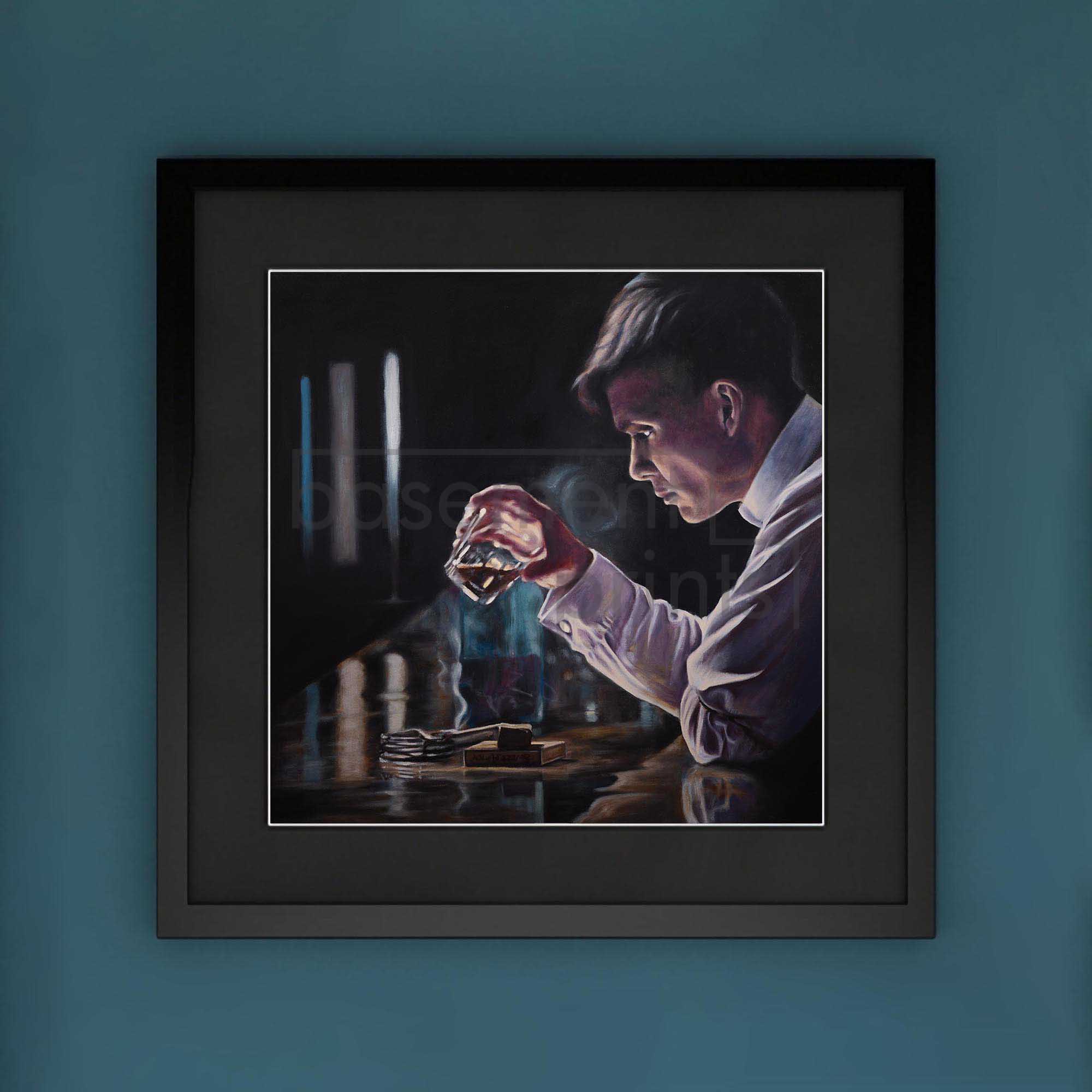 Framed artwork Thomas Shelby from Peaky Blinders holding a whisky glass against a dark background