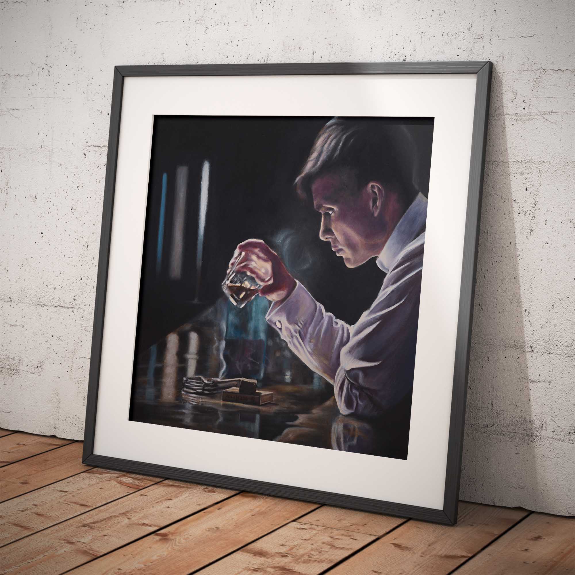 Framed artwork of a person holding a glass against a white brick wall.
